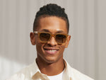 Model is wearing The YONTIF SUN in Blonde in size 49 with Forest Green Tinted Lenses