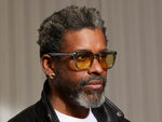 Model is wearing The YONTIF in Sage in size 52 with Pastel Yellow Tinted Lenses