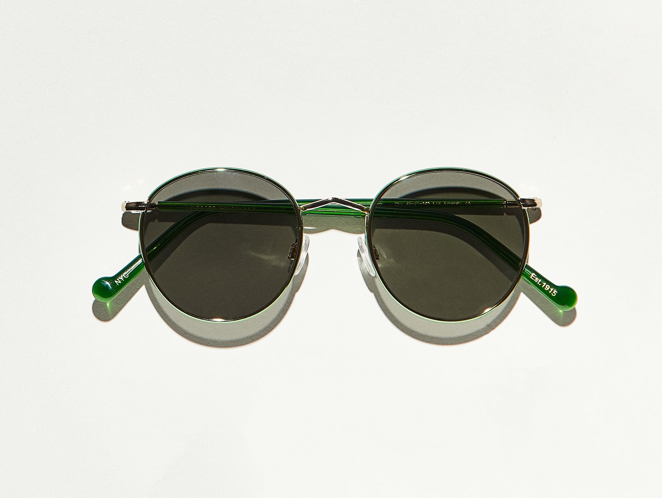 The ZEV SUN in Emerald/Gold with Grey Glass Lenses
