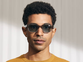 Model is wearing The ZINDIK SUN in Brown Smoke in size 51 with Blue Glass Lenses