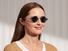 Model is wearing The ZOLMAN SUN in Light Grey in size 42 with G-15 Glass Lenses