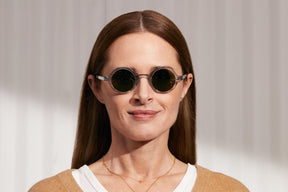 Model is wearing The ZOLMAN SUN in Light Grey in size 42 with G-15 Glass Lenses